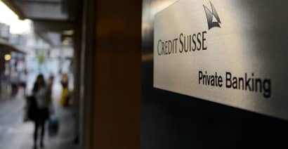 Credit Suisse steps up cost cuts
