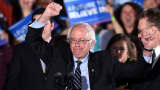 Democratic presidential candidate Bernie Sanders celebrates victory during a primary night rally in Concord, New Hampshire, on February 9, 2016.