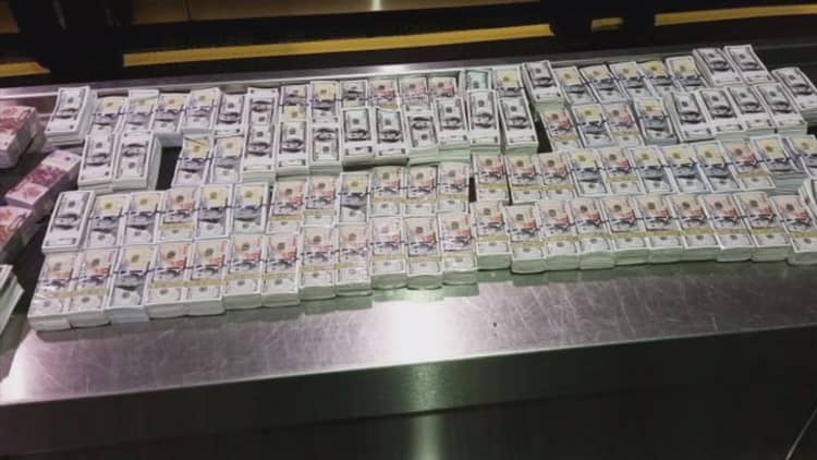 Couple caught smuggling $5M in fake money