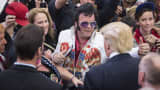 A man dressed as Elvis meets republican presidential candidate Donald Trump as he greets supporters after speaking during a campaign rally at South Point Arena in Las Vegas, NV on Monday Feb. 22, 2016.