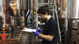A worker at the Half Full Brewery in Stamford, Conn.
