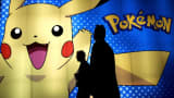 Members of the trade walks past the 'Pokemon' booth