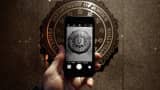 The official seal of the Federal Bureau of Investigation is seen on an iPhone's camera screen outside the J. Edgar Hoover headquarters February 23, 2016 in Washington, DC.