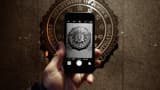 The official seal of the Federal Bureau of Investigation is seen on an iPhone's camera screen outside the J. Edgar Hoover headquarters on Feb. 23, 2016, in Washington, D.C.