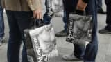 Abercrombie & Fitch bags held by shoppers
