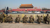 Armed police officers clean handrails at Tiananmen Square ahead of The Fourth Session of the 12th National People's Congress.