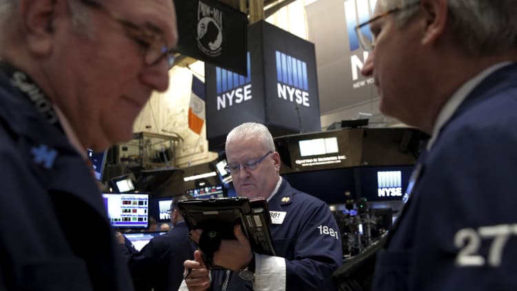 Wall Street on uncertain ground as earnings season begins
