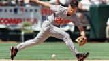 Cal Ripken Jr. stretches to reach a ground ball during a game in 1997