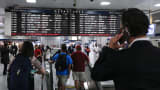 People arrive at Pennsylvania Station from a NJ Transit train in New York City.