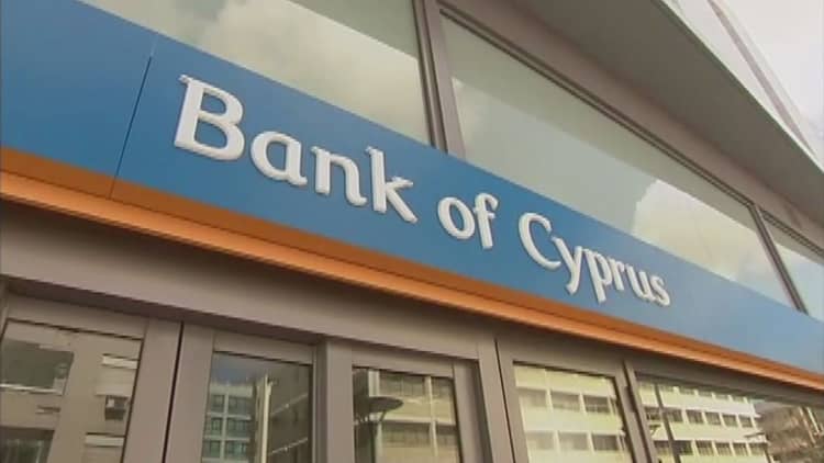 Cyprus exits bailout with cash to spare
