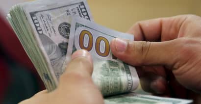 Trade optimism yields dollar's first positive week this year