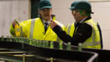 British Chancellor and Conservative MP George Osborne tours the production line during a visit to Britvic Soft Drinks Ltd on April 1, 2015 in Leeds, United Kingdom.