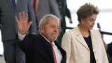 Brazil's former president, Luiz Inacio Lula da Silva (L) walks with President Dilma Rousseff as he is sworn in as the new chief of staff in the Planalto Palace on March 17, 2016 in Brasilia, Brazil.