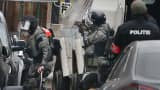Police at the scene of a security operation in the Brussels suburb of Molenbeek in Brussels, Belgium, March 18, 2016.