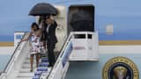US President Barack Obama, accompanied by first lady Michelle Obama and their daughters Malia and Sasha, arrives at the Jose Marti international airport in Havana, Cuba March 20, 2016.