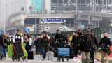 Passengers evacuated from Zaventem Bruxelles International Airport after a terrorist attack on March 22, 2016 in Brussels.