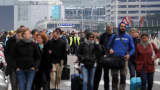 Passengers are evacuated from Zaventem Bruxelles International Airport after a terrorist attack on March 22, 2016 in Brussels, Belgium.