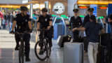 Airport police patrol on bicycle in Tom Bradley International Terminal at LAX airport as security is heightened in reaction to bomb attacks in Brussels, Belgium this morning on March 22, 2016 in Los Angeles, California.