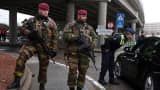Belgian military officers stand guard outside of the closed Brussels Zaventem airport on March 23, 2016 in Brussels, Belgium.