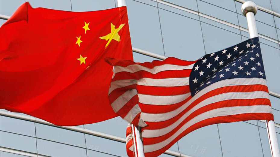 The flags of United States and China outside a commercial building in Beijing, China.