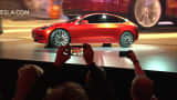 Tesla Motors unveils the new lower-priced Model 3 sedan at the Tesla Motors design studio in Hawthorne, Calif., Thursday, March 31, 2016.
