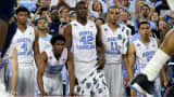 Isaiah Hicks #4 of the North Carolina Tar Heels, Kenny Williams #24, Joel James #42, Brice Johnson #11, and Marcus Paige #5 look on from the bench in the first half against the Villanova Wildcats during the 2016 NCAA Men's Final Four National Championship game at NRG Stadium on April 4, 2016 in Houston, Texas.