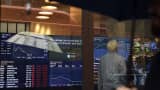 A man monitors trading on the electronic share board at the Australian Stock Exchange in Sydney.