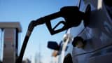 A gasoline pump nozzle refuels a sport utility vehicle in Bagdad, Kentucky.