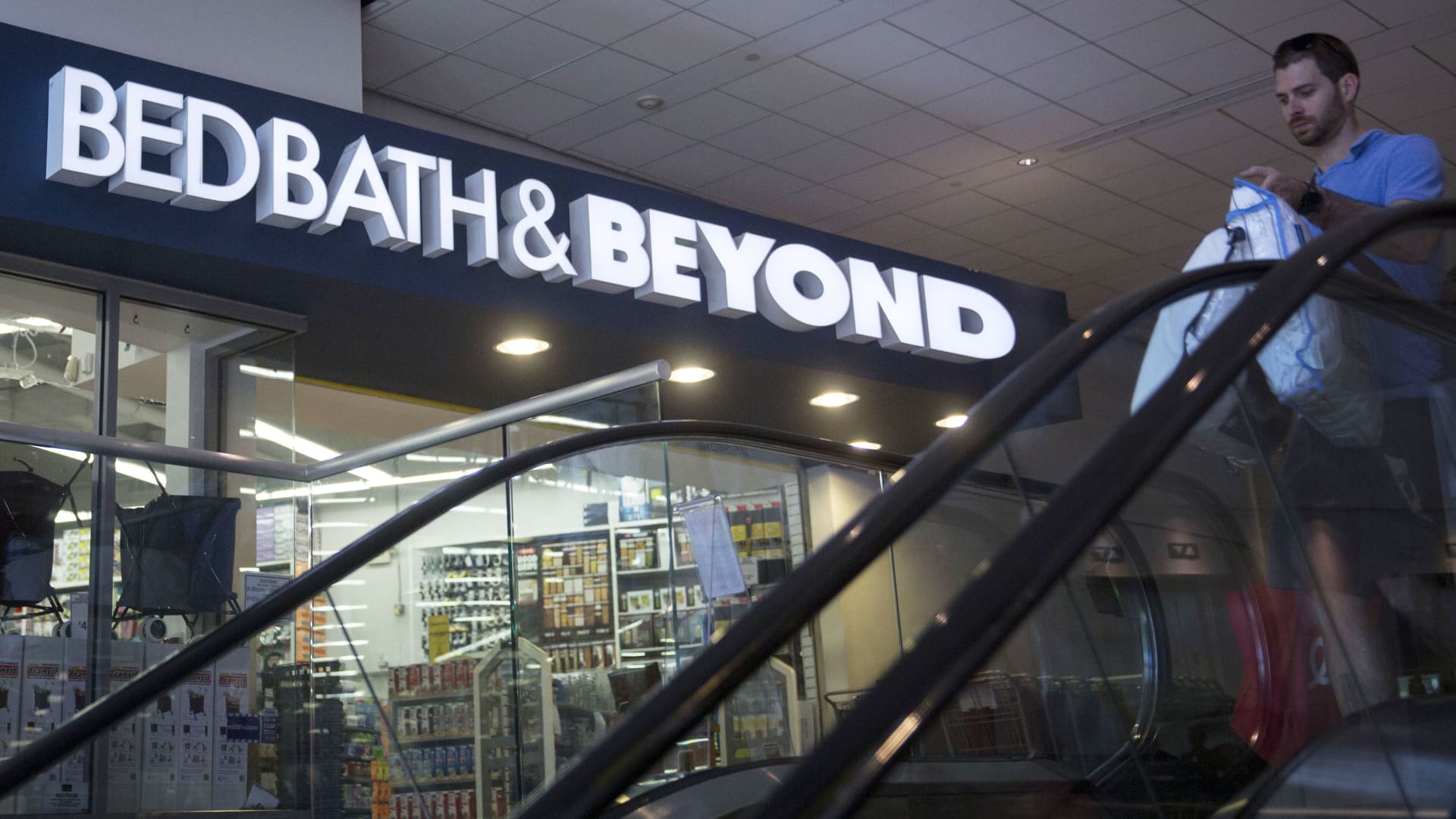 A shopper walks past a Bed Bath & Beyond Inc. store