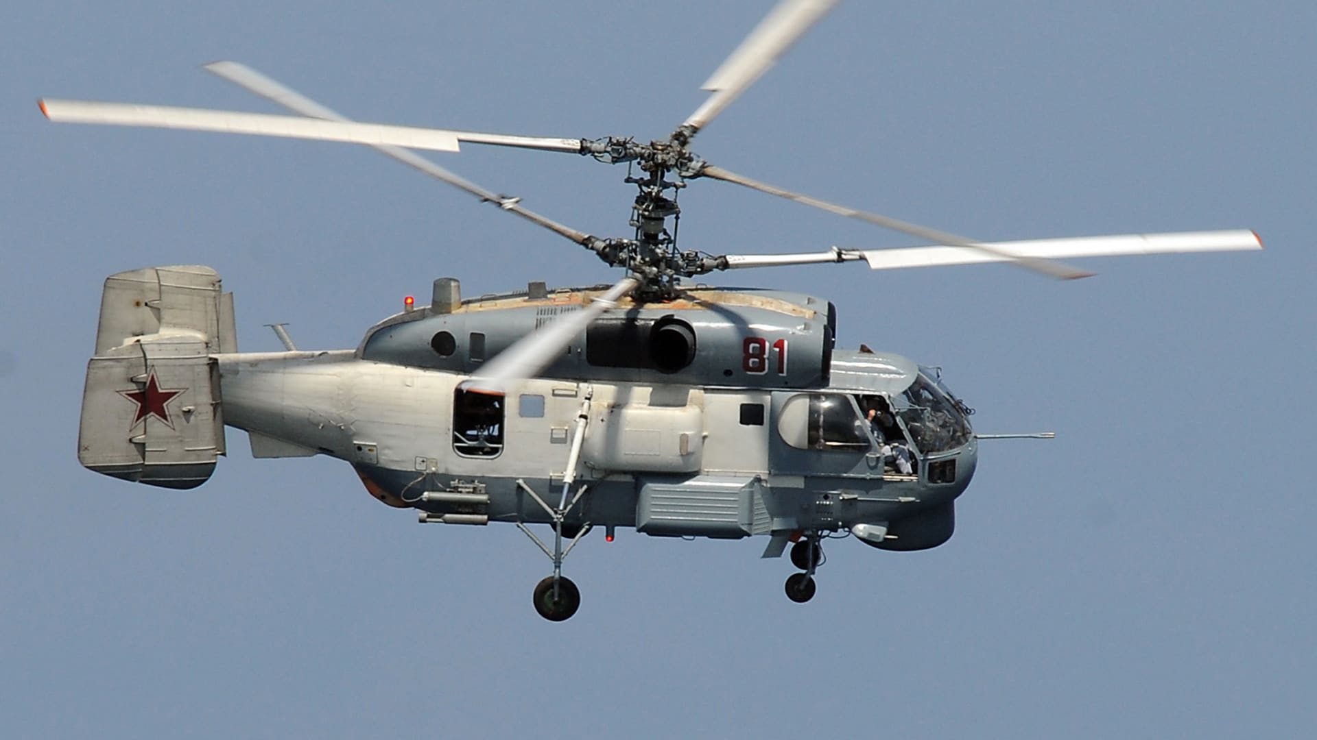 A Russian Helix KA-27 helicopter flies near the guided-missile cruiser USS Vella Gulf while conducting operations in the Gulf of Aden, in this U.S. Navy picture taken Feb. 9, 2009.