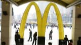 People walk past a McDonald's restaurant on April 21, 2007 in Shenyang of Liaoning Province, China.