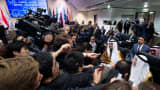 Saudi Arabia's minister of Oil and Mineral Resources Ali al-Naimi is surrounded by journalists at an OPEC meeting.