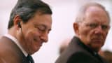 Mario Draghi, president of the European Central Bank (ECB), left, and Wolfgang Schaeuble, Germany's finance minister.