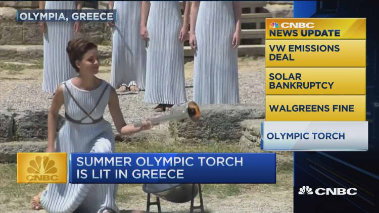 CNBC update: Olympic torch lit