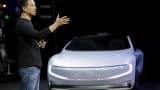 Jia Yueting, LeEco founder, gestures as he unveils an all-electric battery "concept" car called LeSEE during a ceremony in Beijing, China April 20, 2016.