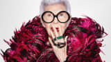 Iris Apfel displays WiseWear’s fashionable smart bracelets, which can track activities or send distress alerts using Bluetooth technology.