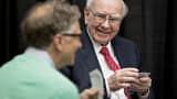 Warren Buffett, chairman and chief executive officer of Berkshire Hathaway Inc., laughs while playing cards on the sidelines the Berkshire Hathaway annual shareholders meeting in Omaha, Nebraska, on Sunday, May 1, 2016.