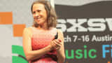 Anne Wojcicki speaking at a SXSW event.