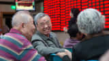 Investors talk at an exchange hall as they observe stock market in Nanjing, Jiangsu Province of China.