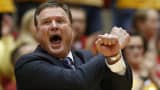 Head coach Bill Self of the Kansas Jayhawks signals a play from the bench in the first half of play against the Iowa State Cyclones at Hilton Coliseum on January 25, 2016 in Ames, Iowa.