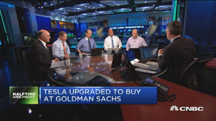 Goldman upgrades Tesla; Analyst disagree