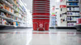 Target Corp. shopping baskets sit on the floor of a company store