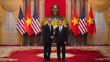 US President Barack Obama (L) shakes hands with Vietnamese President Tran Dai Quang during his visit to the Presidential Palace in Hanoi on May 23, 2016. Obama was to meet communist Vietnam's senior leaders on May 23, kicking off a landmark visit that caps two decades of post-war rapprochement, as both countries look to push trade and check Beijing's growing assertiveness in the South China Sea.