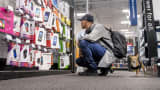 A shopper browses prepaid phone merchandise at a Best Buy store in San Francisco.