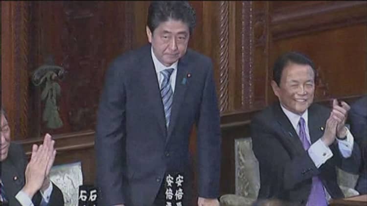 Japan's Abe to delay sales tax hike until late 2019