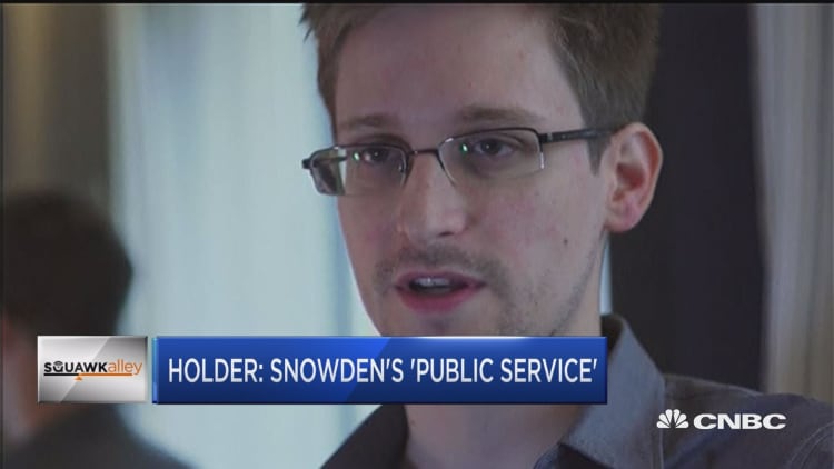 Holder gives Snowden credit