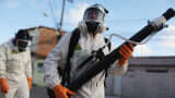 Health workers fumigate in an attempt to eradicate the mosquito which transmits the Zika virus on January 28, 2016 in Recife, Pernambuco state, Brazil.