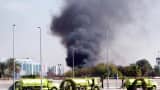 Smoke billowing from the US consulate in the Saudi Red Sea city of Jeddah 06 December 2004, Gunmen stormed the US consulate in Jeddah today, killing four guardsmen and seizing local staff in a hail of gunfire in the latest attack against foreigners in the oil-rich kingdom.