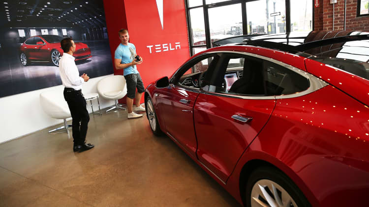 Tesla revs up production on heels of EPS miss