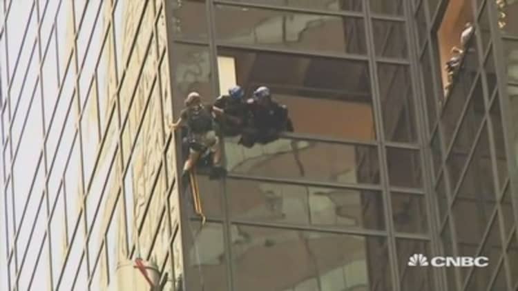 Climber pulled off Trump Tower mid climb